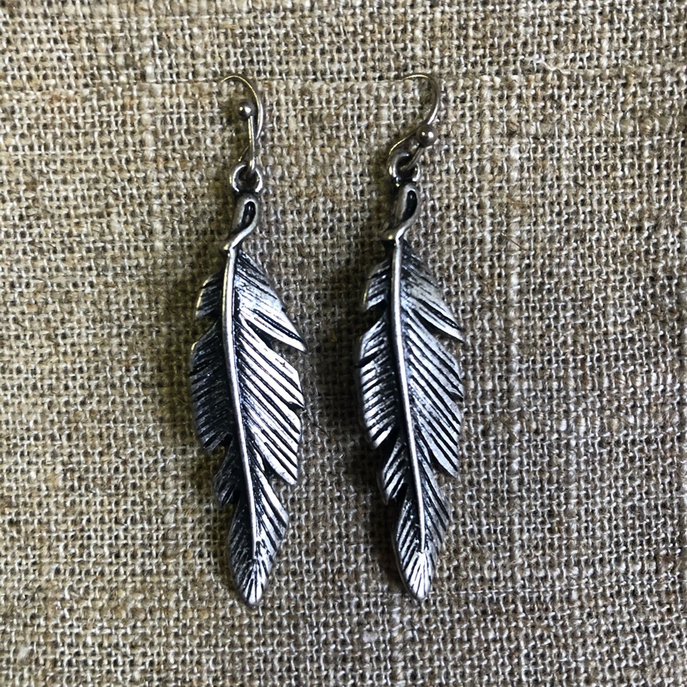 Steel feather earrings.